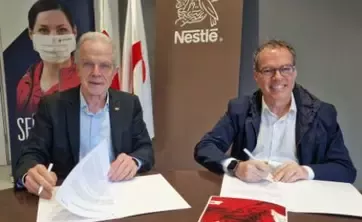 Firma de Nestlé con la Cruz Roja