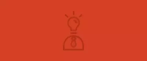 Icono naranja ilustrado con una bombilla iluminada